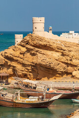 Middle East, Arabian Peninsula, Al Batinah South. Tower at the harbor entrance in Sur, Oman.