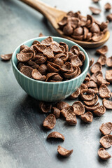 Sweet chocolate breakfast cereal flakes in bowl.