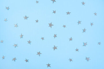Blue background with silver stars. Pattern
