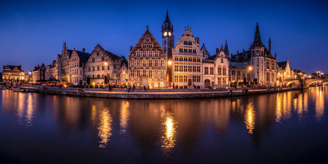 Fototapeta na wymiar Europe, Belgium, Ghent. Panoramic of town and canal reflections at night.