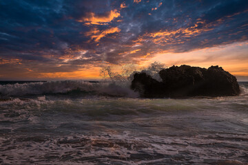 Fantastic seascape with waves crashing onto rocks. Corfu island, Greece.
