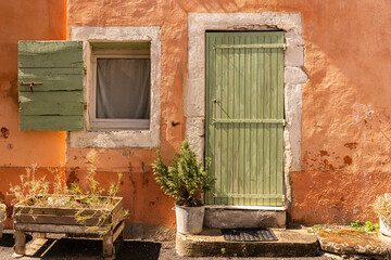 Fototapeta na wymiar Europe, France, Cereste. Weathered old house exterior.