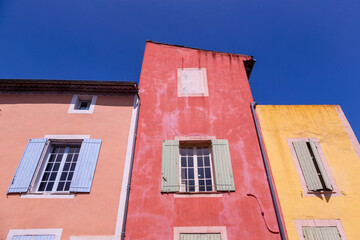 Fototapeta premium Europe, France, Roussillon. Exterior of painted houses.