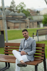 Fototapeta premium Businessman is sitting on the bench