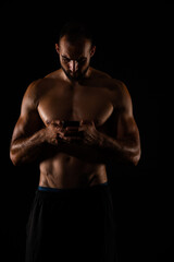 Fototapeta premium Checking his phone while taking a break