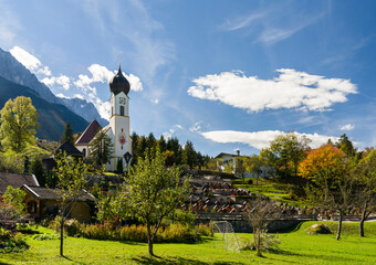 Church St. Johannes der Taufer (John the Baptist), Mount Zugspitze in the background. Village...