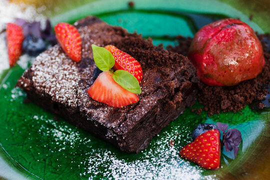 chocolate cake with strawberry and ice cream