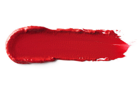 Red smudged lipstick swatch isolated on white background.