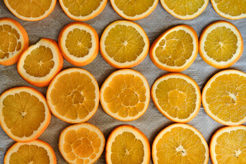 Close-up of oven tray full of fresh orange slices shot directly above for Christmas/seasonal home decoration