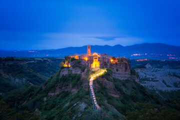 Fototapeta na wymiar Europe, Italy, Civita di Bagnoregio. Medieval hilltop town lit at sunset.
