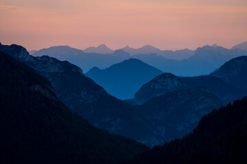 Europe, Italy, Friuli Venezia Giulia. Foggy Monte Lussari mountain at sunset.
