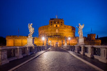 Europe, Italy, Rome. Bridge to Castel Sant'Angelo lit at night.