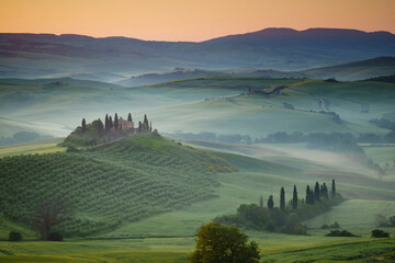 Europe, Italy, Tuscany, Val d' Orcia. Belvedere farmhouse at sunrise.