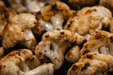 Roasted cauliflower with herbs and spices. Vegetarian food, healthy food baked in the oven. Selective focus