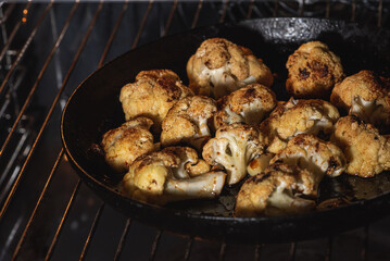 Roasted cauliflower with herbs and spices. Vegetarian food, healthy food baked in the oven. Selective focus