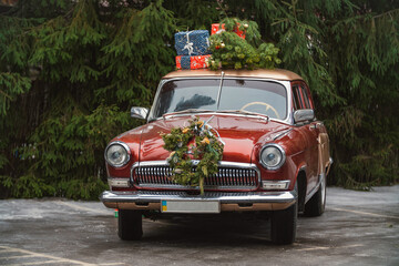 retro red car with gifts on the roof