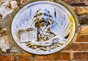Winged Lion Venetian symbol, Piazza San Marco, Saint Mark's Square, Venice, Italy. Winged Lion also symbol of Mark gospel writer. - obrazy, fototapety, plakaty