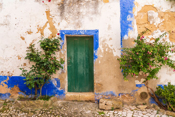 Fototapeta na wymiar Europe, Portugal, Obidos. Weathered house exterior.