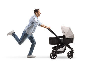 Full length profile shot of a cheerful father running and pushing a stroller