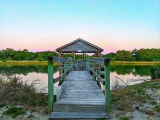 Beautiful view of a gazebo on the lake surrounded by trees