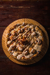 Delicious Pizza Classic Homemade Tomato Sauce Sausage Cheese Onion Chicken Meat Pasta Shrimp Restaurant Menu Gourmet on a wooden table Dark Background