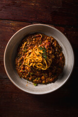 Delicious Pizza Classic Homemade Tomato Sauce Sausage Cheese Onion Chicken Meat Pasta Shrimp Restaurant Menu Gourmet on a wooden table Dark Background