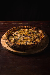 Delicious Pizza Classic Homemade Tomato Sauce Sausage Cheese Onion Chicken Meat Pasta Shrimp Restaurant Menu Gourmet on a wooden table Dark Background