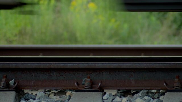 Closeup of Train Wheels on Railroad as it is passing by.