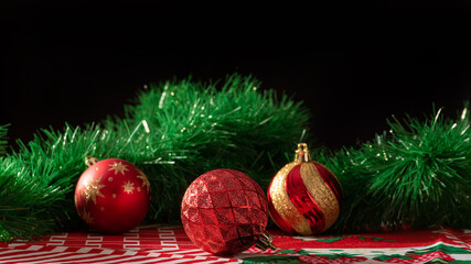 Christmas ornaments, arrangement made with a few Christmas ornaments on a table, selective focus.