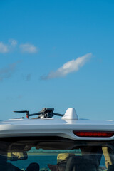 Fototapeta na wymiar Drone Launching Pad On Roof Of Car