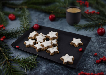 Christmas cookies on a decorated table with coffee