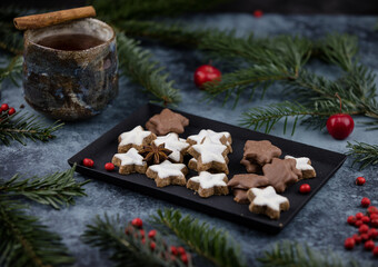 Obraz na płótnie Canvas Christmas cookies on a decorated table with tea 