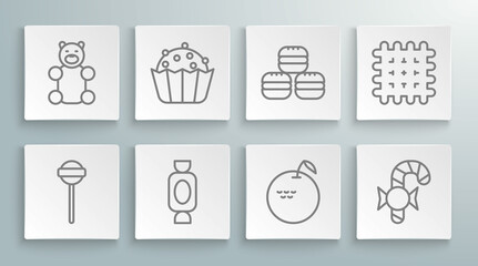 Set line Lollipop, Cupcake, Candy, Apple, Christmas candy cane, Macaron cookie, Cracker biscuit and Jelly bear icon. Vector