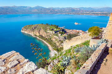 View of the Akronafplia Fortress from the Venetian Palamidi Fortress along with the sea and peninsula of the city of Nafplio, in the Peloponnese region of Greece.