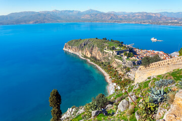 View of the Akronafplia Fortress from the Venetian Palamidi Fortress along with the sea and peninsula of the city of Nafplio, in the Peloponnese region of Greece.