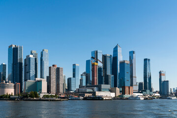 Fototapeta na wymiar New York City skyline from New Jersey over the Hudson River with the skyscrapers of the Hudson Yards district at day time. Manhattan, Midtown, NYC, USA. A vibrant business neighborhood