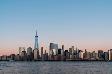 Fototapeta na wymiar Skyline of New York City Financial Downtown Skyscrapers at sunset. Manhattan, NYC, USA. A vibrant business neighborhood
