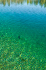 Fototapeta na wymiar Sweden, Gotland Island, Labro, Bla Lagunen, Blue Lagoon, natural swimming area in former chalk quarry with blue green water