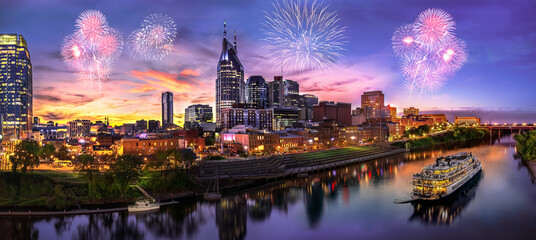 Fototapeta premium Nashville skyline with sunset and fireworks