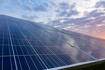 Solar power plant, solar panel, blue sky and clouds