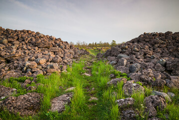 Fototapeta na wymiar Sweden, Oland Island, Ismantorp, ruins of Ismantorp fortress, Bronze Age fortified town, sunset