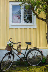 Fototapeta na wymiar Southern Sweden, Karlskrona, Bjorkholmen area, the neighborhood of naval craftsmen, bicycle