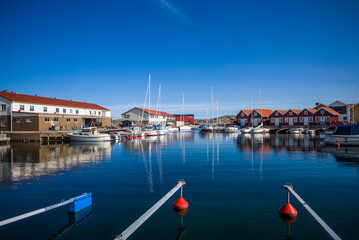 Fototapeta na wymiar Sweden, Bohuslan, Tjorn Island, Kladesholmen, a view of the village and harbor