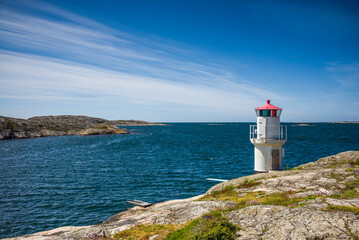 Fototapeta na wymiar Sweden, Bohuslan, Orust Island, Mollosund, small lighthouse