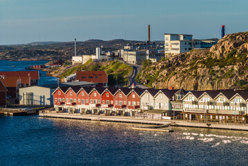 Sweden, Bohuslan, Kungshamn, high angle view of coastal houses and factory