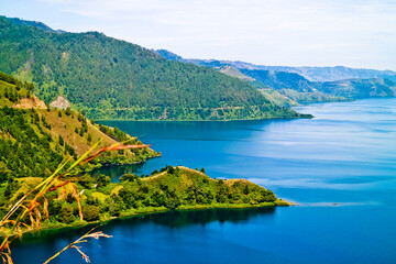 Fototapeta na wymiar The beauty of Lake Toba which is a caldera lake comes from an ancient volcanic eruption and is the largest volcanic lake in the world. North Sumatra, Indonesia