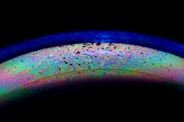 The bright colors seen in an oil slick floating on water or in a sunlit soap bubble are caused by interference