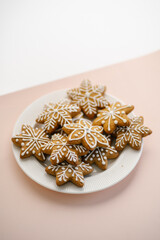 Ginger cookies on the on a delicate peach background.