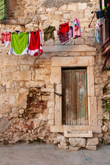Split, Croatia. Laundry hanging on a line in front of an old building. (Editorial Use Only)