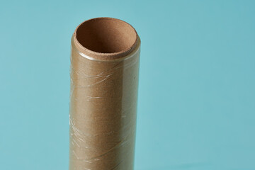 cardboard tube with transparent adhesive plastic.